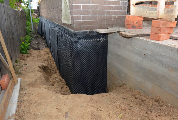 SJ Waterproofing Pros technician performing targeted Wet Basement Repair assessment in Plainview, TN